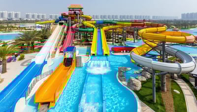 Aerial view of AquaQuest Adventure Park Dubai with water slides and pools Aerial view of AquaQuest Adventure Park Dubai with water slides and pools